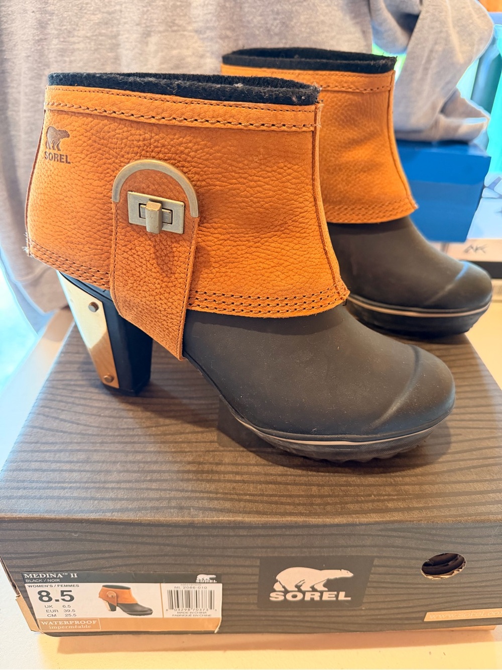 Sorel Two-Tone Tan and Black Heeled Ankle Boots